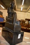 A good cast bronze of a seated female figure on a marble base.