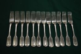 A set of twelve silver table forks.