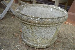 A large pair of reconstituted stone planters (both with cracks).