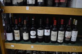 Thirty bottles of various red wine.