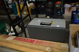 A projector, photographic enlarger, folding screens and a sewing machine.