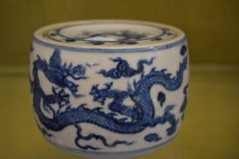 A Chinese blue and white drum shaped bowl and cover.