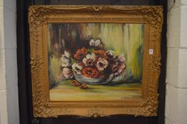 Still life of flowers in a bowl, oil on board in a decorative gilt frame.