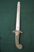 An Eastern dagger with hard stone handle.