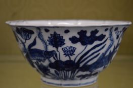 A Chinese blue and white petal shaped bowl painted with fish.