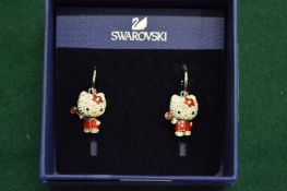 A pair of Swarovski kitten earrings.