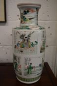 A large Chinese famille verte vase decorated with panels of figures.