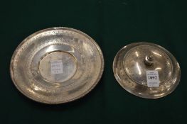 An engraved silver cover and stand (35).