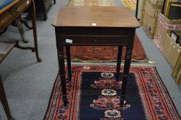 A small 19th century mahogany work table with rising top.