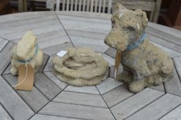 A garden ornament modelled as a dog and two other items.