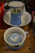 Decorative jug and bowl set with chamber pot and soap dish.