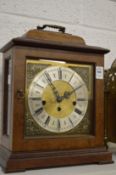 A Georgian style walnut cased mantel clock.