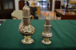 Two silver pedestal castors.