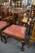 A pair of George III style mahogany armchairs.