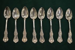 A set of six silver coffee spoons.