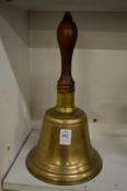 A large bronze hand bell.