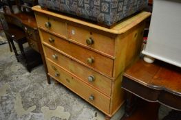 A pine chest of drawers.