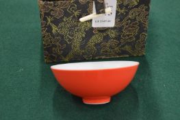 A Chinese red glazed porcelain small bowl with original box.