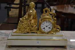 A marble and ormolu figural mantel clock.