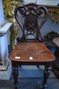 A good pair of 19th century mahogany hall chairs.