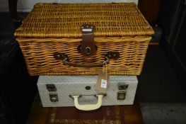 A wicker picnic hamper and a Brexton picnic hamper.