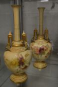 A pair of Royal Worcester blush ivory bottle vases.