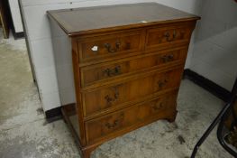 A yew wood chest of drawers.