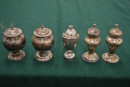 A collection of silver pepperettes (20).