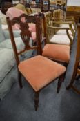 A pair of Victorian dining chairs.