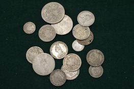 A group of early silver coins.