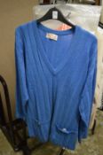 A ladies blue woollen jumper.