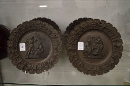 A set of four cast metal classical design plaques.