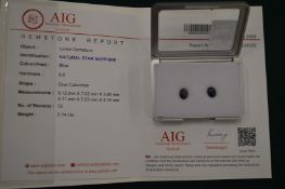 A pair of oval cabochon natural star sapphires with certificates.