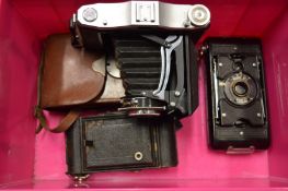 Three old cameras.
