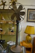 A large floor standing adjustable electric fan.