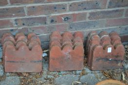 Twelve terracotta edging tiles.