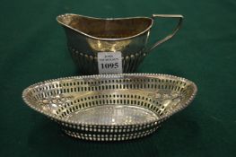 A small silver jug and a silver dish with pierced sides (26).