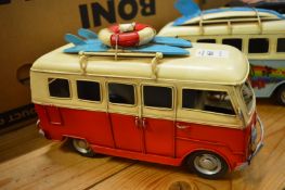 Tin plate model of a surfer camper van.