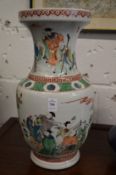 A large Chinese famille verte vase decorated with figures.