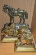 A brass horse shaped door stop and a pair of similar doors stops/boook ends.