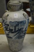 A large Chinese part glazed vase with four loop handles.