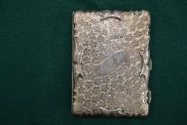 An engraved silver combination card case and aide memoire.