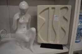 A Royal Dux white porcelain figure of a seated female nude together with a modern abstract