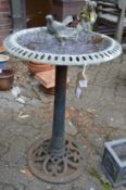 Cast metal bird bath.