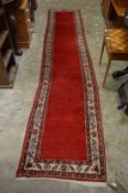 A Persian style runner, 352cm x 72cm.