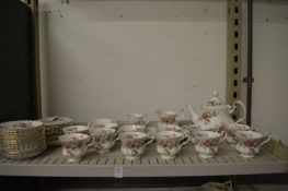 A Royal Albert Moss Rose twelve place tea service (one tea plate broken).