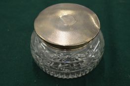 Silver topped cut glass dressing table jar.
