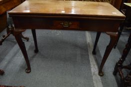 A George III mahogany rectangular fold-over tea table with a single drawer on cabriole legs.