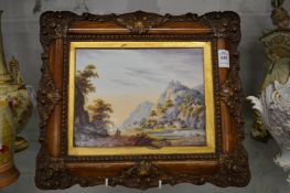 A Continental porcelain plaque depicting a mountainous landscape with a figure on horseback, mounted