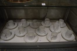 White porcelain coffee cups and saucers.